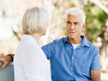 Senior couple relaxing in summer parkの写真素材