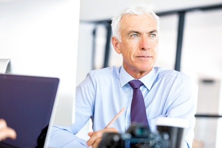 Handsome businessman at the officeの写真素材