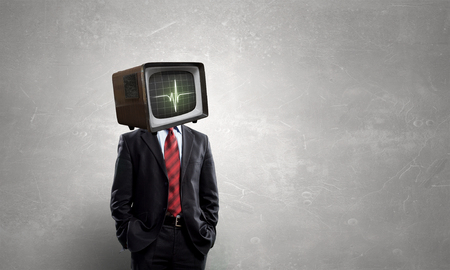 Unrecognizable businessman with monitor instead of headの写真素材