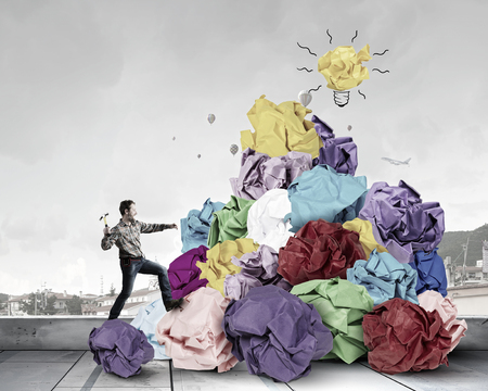 Repairman and crumpled paper as symbol of creativity and inspirationの写真素材