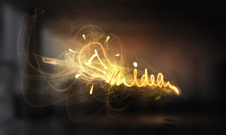 Idea concept with light bulb drawn on dark background. Mixed mediaの写真素材