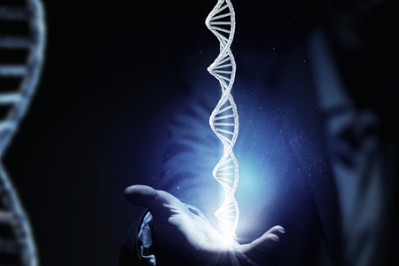 Close up of female hand and DNA molecule research conceptの写真素材