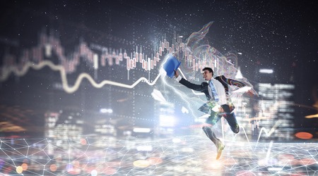 Cheerful businessman against media background running in a hurryの写真素材