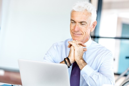 Handsome businessman at the officeの写真素材