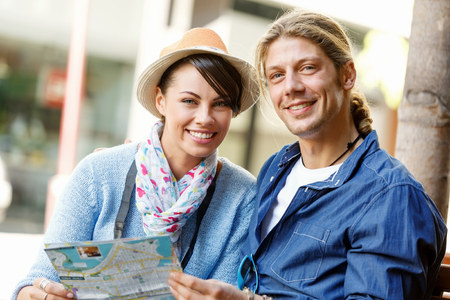Young couple of tourists on the streets of a cityの写真素材