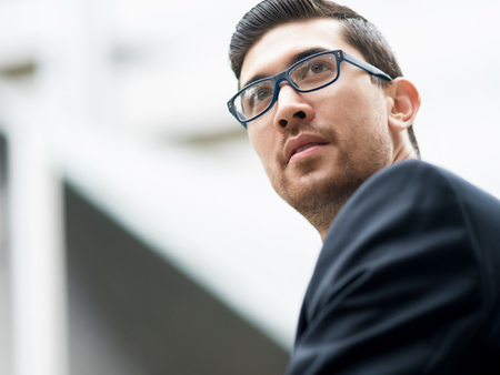 Portrait of young handsome businessman outdoorの写真素材
