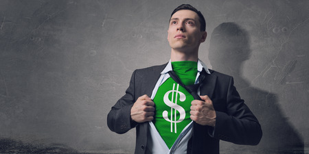 Businessman in classic pose tearing his shirt on chestの写真素材