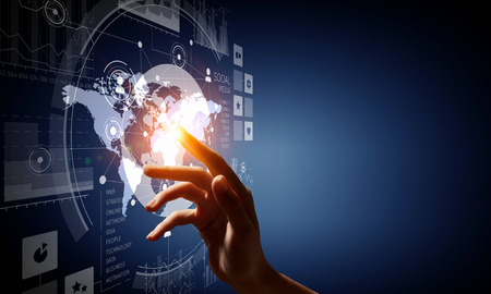 Close up of businessman touching virtual panel with finger