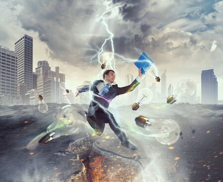 Determined businessman jumping over crack in asphalt road