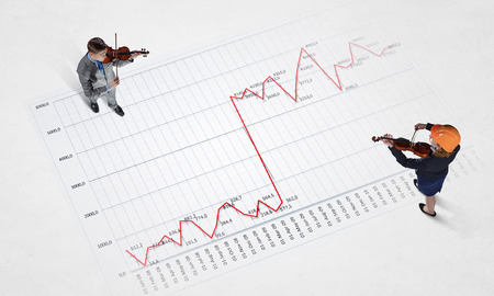 Top view of business people in formalwear standing on infographsの写真素材