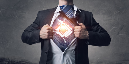 Businessman in classic pose tearing his shirt on chestの写真素材