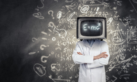 Doctor in white with old TV set instead of headの写真素材
