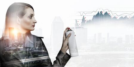 Exposure image of elegant businesswoman and business cityの写真素材