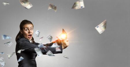 Young pretty woman in suit using her tablet pcの写真素材