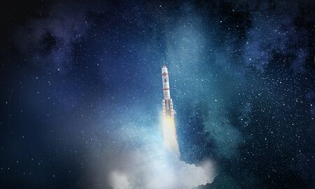 Missile rocket flying high in dark skyの写真素材