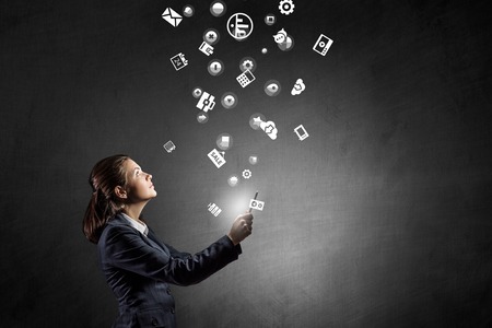 Businesswoman using tablet pc and its display interfaceの写真素材