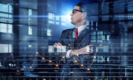 Senior businessman with arms crossed on chest against exposure background. Mixed media