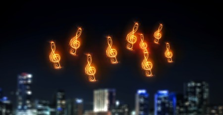 Music clef glowing symbol on dark backgroundの写真素材