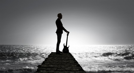 Elegant guitarist silhouette . Mixed mediaの写真素材