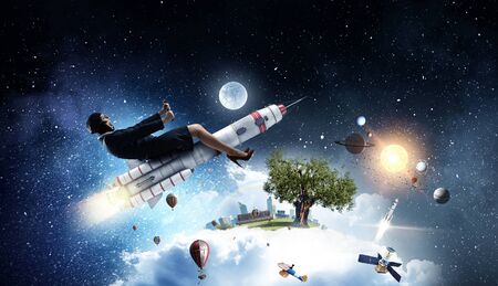 Woman on space rocket . Mixed mediaの写真素材