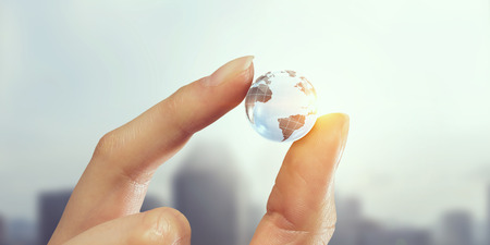 Whole world in hand . Mixed mediaの写真素材