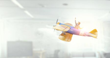 Student girl in old airplane . Mixed media . Mixed mediaの写真素材