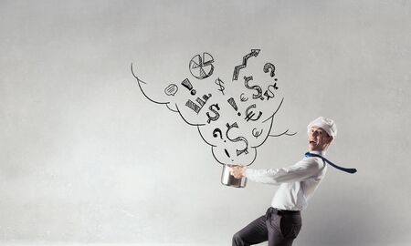 He is cooking something special . Mixed mediaの写真素材