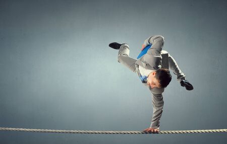 Young businessman breakdancer. Mixed media . Mixed mediaの写真素材