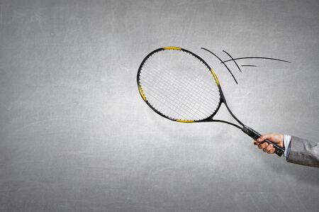 Racket in person hand . Mixed mediaの写真素材