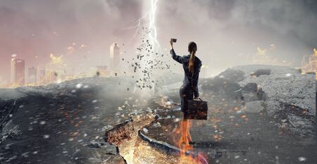 Businesswoman catching moment on her mobile . Mixed mediaの写真素材