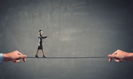 She is walking blindfolded . Mixed mediaの写真素材