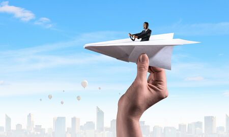 Woman Aviator floating in sky . Mixed mediaの写真素材