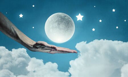 Moon in hand    . Mixed mediaの写真素材
