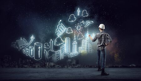 Builder woman sketching project    . Mixed mediaの写真素材