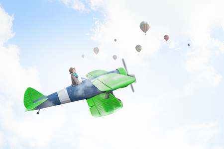 Woman in drawn airplane . Mixed mediaの写真素材