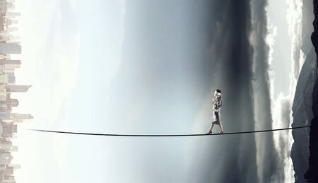 She is walking blindfolded . Mixed mediaの写真素材