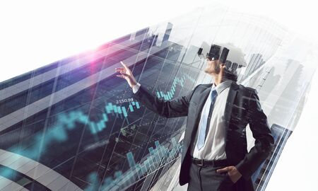 Man in virtual helmet . Mixed mediaの写真素材