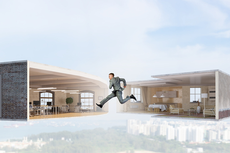 Jumping businessman in office. Mixed media . Mixed mediaの写真素材