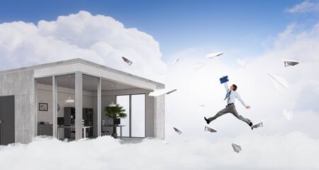 Jumping businessman in office. Mixed media . Mixed mediaの写真素材