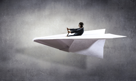 Woman Aviator floating in sky . Mixed mediaの写真素材