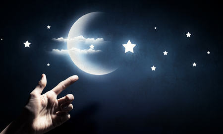 Moon in hand . Mixed mediaの写真素材