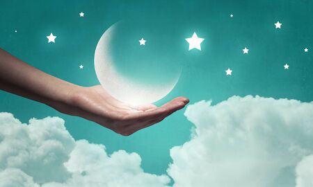 Moon in handの写真素材