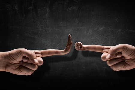 Close of hand and fist gesture on forefinger