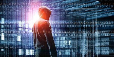 Silhouette of hacker in hoody on digital background