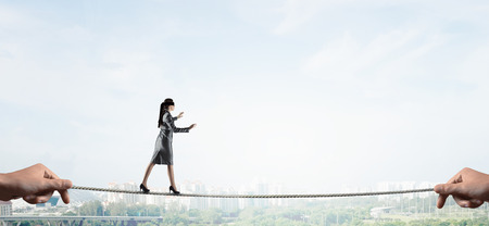 She is walking blindfolded . Mixed mediaの写真素材