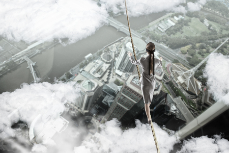 She is walking blindfolded . Mixed mediaの写真素材