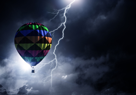 Aerostat flying above clouds . Mixed mediaの写真素材