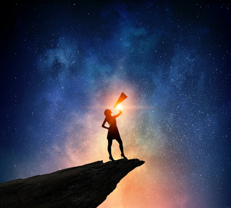 Businesswoman against starry sky . Mixed media . Mixed mediaの写真素材