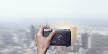 Man with camera in handsの写真素材