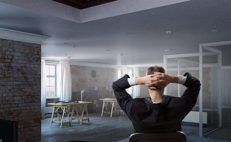 Businessman in chair having rest